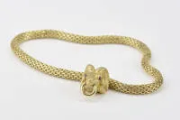 Necklace, ram's head pendant on tubular chain, 18kt yellow gold, 2 small ruby cabochons as eyes, 44 cm length, approx. 101 g