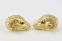 Pair of ear clips, ram's head motif, 18kt yellow gold, 2 small ruby cabochons as eyes, 25.7 g
