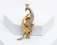 Peacock brooch, 18kt yellow gold / platinum 950, diamond roses, small ruby cabochons as eye and head ornament, approx. 12.2 g