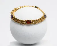 Armband, 18kt Gelbgold, 5 verschieden bunte Farbsteine, darunter Citrin, Amethyst, Peridot, Iolith, ca. 36.5 g, ca. 18 cm lang