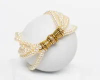 Bracelet de perles, 5 rangs, fermoir or jaune 18 carats, 11 brillants tot. env. 0,30 ct., longueur env. 22,5 cm