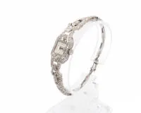 Art Deco cocktail watch, Hafis, Switzerland, circa 1930, platinum, rich diamond decoration, bracelet with openwork geometric design, manual winding movement, total weight approx. 21 g, movement started in test, accuracy untested