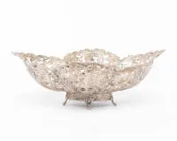 Confectionery basket, silver 800, oval form, openwork wall, leaf and foliage, small smooth centre, on small base with four feet, 9 x 24 x 17 cm, approx. 251 g