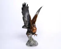 Porcelain figurine, "Golden Eagle", Hutschenreuther, Germany, Kunstabteilung, polychrome, in flight, model by Karl Tutter (1883-1969), 44 cm high, one claw chipped