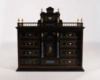 Sumptuous Italian Pietra Dura table cabinet, probably Florence, 2nd half 17th c., rectangular ebony body on profiled base and corresponding cornice, three-sided baluster gallery with gilded balusters...