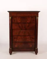 Chiffonnier / Semainier, Empire, France, 1st half 19th c., pyramid mahogany veneer, rectangular body flanked by two columns, seven drawers, black marble top, 145 x 102 x 58 cm.