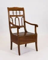 Biedermeier commode chair, 19th c., solid walnut, hinged seat, frame openable at rear, openwork back, without faience insert, h. 108 cm