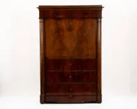 Biedermeier secretary desk, North German/Prussia, circa 1825, pyramid mahogany veneer, tall rectangular body with applied full columns, flat base drawer, three further drawers, fall front and a top drawer, interior with veneered...