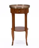 Side table in Louis XVI style, France, circa 1900, rosewood veneer, round top with brass gallery, frieze drawer, four curved legs with connecting stretcher, H. approx. 68 cm, ø approx. 35 cm