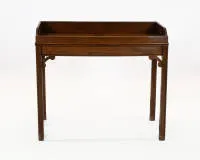 Butler's tray table, England, 20th c., mahogany, removable tray with openwork handles on four-legged stand, approx. 63.5 x 75 x 50 cm