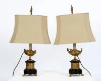 Pair of table lamps, Napoleon III, France, mid-19th c., stem with fire-gilt bronzes in vase form, stone base each with three gilded paw feet, H. 72 cm each, electrified