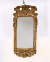 Rococo mirror, Louis XV, circa 1750, crest tilted forward with openwork rocailles, 72 x 31 cm, glass probably replaced