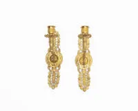 Pair of Empire wall sconces, France, circa 1820, fire-gilt bronze, one-light each, wall plate with stylized flower bouquets, curved arms, rim with stylized petals, 30 x 8 cm each