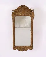 Rococo mirror, Louis XV, France, circa 1765, carved and gilt on red ground frame, 2-part glass, 82 x 37 cm