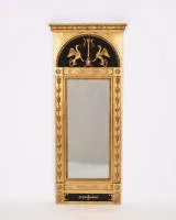 Gustavian wall mirror / trumeau mirror, Empire, Sweden / Stockholm, first third 19th c., black and gold frame, rectangular frame with semi-circular pediment, two griffins around a fire bowl, on the back the city mark of Stockholm...