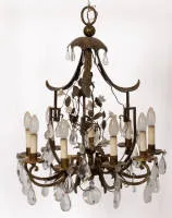 Chandelier, around 1900, metal, nine-light, curved metal arms each with a candle, central metal branches with porcelain flowers, foliage hanging from canopy, richly decorated with glass prisms, 74 cm high, ø 55 cm, electrified