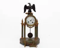 Neoclassical mantel clock, France, circa 1920, Adolphe Mougin (1848 - 1928), movement plate num. "3368" and maker's signature "AD. MOUGIN DEUX MEDAILLES", four-column marble case with metal applications under crowning eagle, white enamelled...