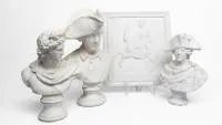 Lot of three plaster busts and a relief depicting Frederick the Great and the Apollo Belvedere, 20th century, height 29 cm, 31 cm, 39 cm and relief dimensions: 35 x 32 x 2 cm, partially stained or dirty, small, inconspicuous...