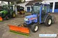 Iseki TH 4330 AHL compact 4WD tractor winter service with hydraulic snow plow and self-loading salt spreader from 2006