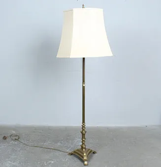 Vintage brass floor lamp with a square base and a cream fabric shade.