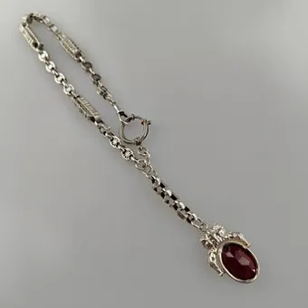 TASCHENUHRENKETTE mit figürlichem Anhänger - Silber.