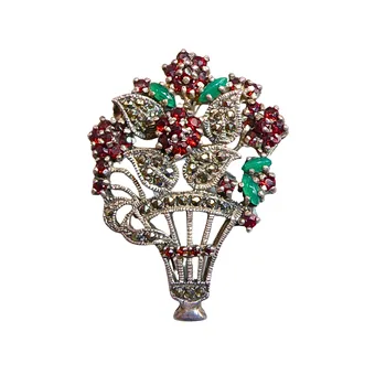 Art Deco flower basket brooch in 835 silver with garnet and jade, also wearable as pendant.