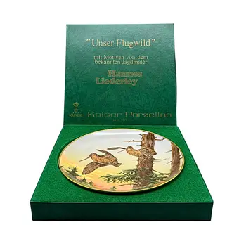 HANNES LIEDERLEY. LIMITOVANÝ PORCELÁNOVÝ TALÍŘ "FRÜHLINGSBOTEN" OD AK KAISER PORZELLAN.