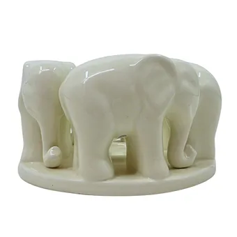 Porcelain candle holder with elephants.