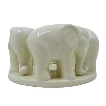 Porcelain candle holder with elephants.