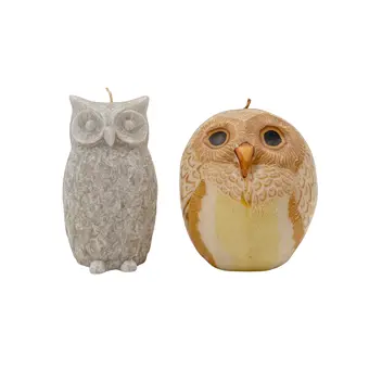 TWO CANDLES SHAPED LIKE OWLS, MOULDED WAX.