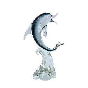 HANDMADE GLASS SCULPTURE OF A DOLPHIN ON A WAVE.