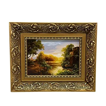 Ingelijst schilderij van een rivierlandschap.