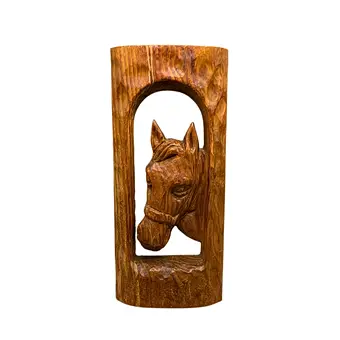 Wooden wall relief with the portrait of a horse.
