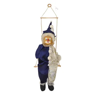 Decorative clown on wooden swing