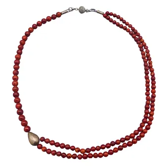 Two-row pearl necklace with teardrop pendant.