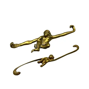 TWO DECORATIVE MONKEY HOOKS MADE OF BRASS, 1950S/1960S.
