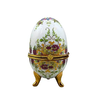 Porcelain egg with hinged lid and floral decoration.