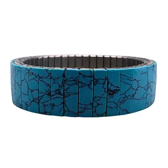 STRETCH-ARMBAND MIT MUSTER IN TÜRKIS.