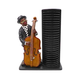 CD-STÄNDER MIT JAZZ-MUSIKER-FIGUR.