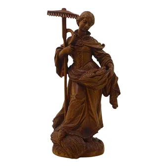 Dřevěná figura svaté Notburgy.
