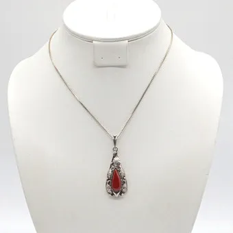 ART NOUVEAU NECKLACE, TEARDROP PENDANT WITH CORAL CABOCHON, FISH AND STARFISH, OPENWORK SETTING IN 835 SILVER, CIRCA 1900