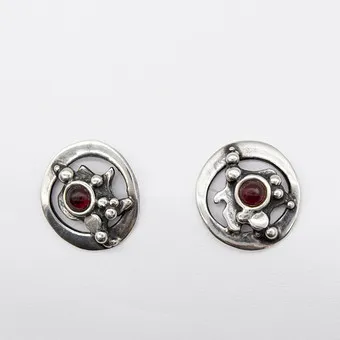 VALDRES SOLVSMIE. A pair of designer ear studs, sterling silver, almandine cabochon, Norway, circa 1970s.