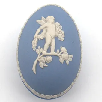 Wedgwood. Blue jasperware decorative egg with relief decor.