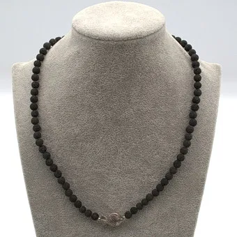 DESIGNER NECKLACE LAVA STONE BEADS, WITH A FISH ELEMENT AND STERLING SILVER CLASP, HALLMARKED.