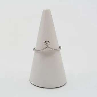Henning Ulrichsen. Modernist designer ring in 14 karat white gold with a small brilliant, "HU", vintage.