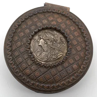 Bronze jewelry box with relief silvered female head; numbered circa 1900.