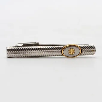 ALFRED DUNHILL. DESIGNER DASSPELD, METAAL, VERZILVERD EN VERGOUD, 20E EEUW.