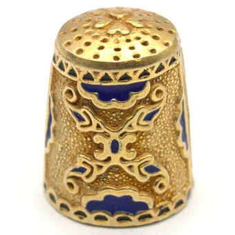 Thimble in gold-plated sterling silver with cobalt blue enamel, Germany 20th century.