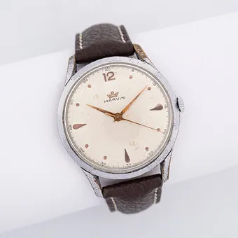 MARVIN WRISTWATCH WITH MARVIN MOVEMENT, CALIBER 560 WITH 17 JEWELS, MANUAL WIND, CHROME-PLATED CASE, STAINLESS STEEL CASE BACK, 1950S, BROWN LEATHER STRAP.
