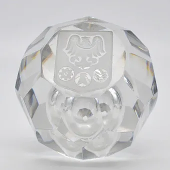 BOHEMIAN GLASS PAPERWEIGHT, EAGLE MOTIF WITH EMBLEMS, FACETED AND HAND-CUT, WITH CONTROLLED AIR INCLUSION, 20TH CENTURY.
